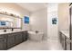 Bright bathroom featuring double vanity, soaking tub, and walk-in shower with marble tiling at 5061 Collingswood Blvd, Port Charlotte, FL 33948