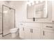 Modern bathroom with frameless shower, marble tile, and modern vanity at 5061 Collingswood Blvd, Port Charlotte, FL 33948