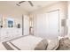 Bedroom with white furniture, closet, and neutral decor at 5061 Collingswood Blvd, Port Charlotte, FL 33948
