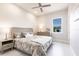 Bright bedroom featuring modern decor, large window, and bright lighting at 5061 Collingswood Blvd, Port Charlotte, FL 33948