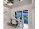 Dining area with views of the water through large sliding glass doors at 5061 Collingswood Blvd, Port Charlotte, FL 33948