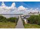 Private dock and boat lift with stunning views of the calm waters and blue skies are perfect for boating enthusiasts at 5061 Collingswood Blvd, Port Charlotte, FL 33948