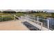 A fenced path leads over the water, connecting the property to a private dock in a beautiful waterside neighborhood at 5061 Collingswood Blvd, Port Charlotte, FL 33948