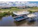 Waterfront property features a private dock, boat lift, and stunning water access for boating and recreation at 5061 Collingswood Blvd, Port Charlotte, FL 33948