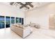 Spacious living area featuring a coffered ceiling, modern furnishings, and stunning water views at 5061 Collingswood Blvd, Port Charlotte, FL 33948