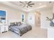 Main bedroom features a ceiling fan and two windows, offering ample natural light at 5061 Collingswood Blvd, Port Charlotte, FL 33948