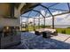 Enjoy the view from the patio with outdoor kitchen, with stainless steel appliances and a blue stone deck at 5061 Collingswood Blvd, Port Charlotte, FL 33948