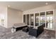 Covered patio with outdoor furniture, ceiling fans, and sliding glass doors at 5061 Collingswood Blvd, Port Charlotte, FL 33948