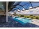 Enjoy the outdoors in this beautiful backyard pool, patio and summer kitchen with serene views at 5061 Collingswood Blvd, Port Charlotte, FL 33948