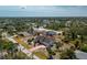Expansive aerial view showcases the property's prime location and generous lot size with mature trees at 5219 Guava Ter, Port Charlotte, FL 33981