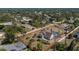 This aerial view highlights a well-maintained property with a pool and lush landscaping at 5219 Guava Ter, Port Charlotte, FL 33981