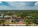 This aerial view shows a well-maintained property with a spacious lot and a convenient three-car garage at 5219 Guava Ter, Port Charlotte, FL 33981