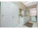 Bathroom with a double sink vanity, linen closet, and ample space at 5219 Guava Ter, Port Charlotte, FL 33981