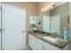 Bathroom featuring a granite vanity top and a closet at 5219 Guava Ter, Port Charlotte, FL 33981
