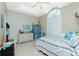 Well-lit bedroom featuring a ceiling fan and closet doors at 5219 Guava Ter, Port Charlotte, FL 33981