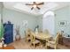 Inviting dining room featuring an oval wooden table with upholstered chairs, bathed in natural light at 5219 Guava Ter, Port Charlotte, FL 33981