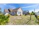 Exterior shot of a home with a screened-in pool, fenced yard, and well-maintained landscaping at 5219 Guava Ter, Port Charlotte, FL 33981