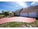 Spacious three-car garage and stamped concrete driveway offer both convenience and enhanced curb appeal at 5219 Guava Ter, Port Charlotte, FL 33981
