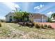 Charming single-story home with a three-car garage, well-maintained landscaping, and a red brick driveway at 5219 Guava Ter, Port Charlotte, FL 33981
