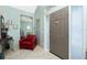 Inviting foyer with a neutral color scheme, tiled floors, and a solid wood front door with sidelights at 5219 Guava Ter, Port Charlotte, FL 33981