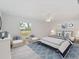 Stylishly decorated bedroom with a ceiling fan, neutral tones, and matching decor at 5353 Kaspar St, Port Charlotte, FL 33981