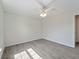 This bedroom has a ceiling fan, fresh paint and attractive tile floors at 5353 Kaspar St, Port Charlotte, FL 33981