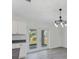 A view of the dining room area with natural light shining through the glass patio doors at 5353 Kaspar St, Port Charlotte, FL 33981