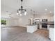 An open concept kitchen and living space with stainless appliances and modern cabinetry at 5353 Kaspar St, Port Charlotte, FL 33981