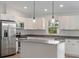 Bright kitchen featuring stainless steel appliances, a central island, and stylish pendant lighting at 5353 Kaspar St, Port Charlotte, FL 33981