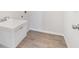 This laundry room features durable tile flooring and a utility sink at 5353 Kaspar St, Port Charlotte, FL 33981