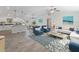 Open-concept living area featuring tile floors, high ceilings, and abundant natural light at 5353 Kaspar St, Port Charlotte, FL 33981