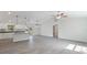 Spacious open-concept layout boasting modern light fixtures and sleek tile floors at 5353 Kaspar St, Port Charlotte, FL 33981