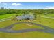 Aerial view of a large lot and circular driveway leading to the beautiful single-Gathering home at 5600 Blackjack S Ct, Punta Gorda, FL 33982