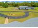 Aerial view of the property featuring a detached garage and long driveway at 5600 Blackjack S Ct, Punta Gorda, FL 33982