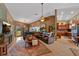 Open living room with tile floors, a leather sectional, and seamless flow into the kitchen, ideal for entertaining at 5600 Blackjack S Ct, Punta Gorda, FL 33982