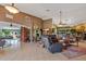 Spacious living room with tile flooring and views into the dining area at 5600 Blackjack S Ct, Punta Gorda, FL 33982