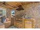 Outdoor kitchen with stainless steel grill, stone backsplash, and prep area at 5600 Blackjack S Ct, Punta Gorda, FL 33982