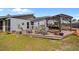 Wooden deck with pergola, outdoor furniture, potted plants and backyard at 5600 Blackjack S Ct, Punta Gorda, FL 33982