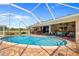 Beautiful backyard pool with a spacious patio and an open living space at 5600 Blackjack S Ct, Punta Gorda, FL 33982