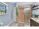 Bright bathroom with tiled shower, and neutral walls at 566 Reading Nw St, Port Charlotte, FL 33952