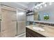 Clean bathroom features a glass shower and a modern vanity at 566 Reading Nw St, Port Charlotte, FL 33952