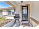 Inviting front porch with seating area and decorative details, creating a welcoming entrance at 566 Reading Nw St, Port Charlotte, FL 33952
