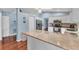 Well-appointed kitchen with granite countertops, breakfast bar, and stainless steel appliances at 566 Reading Nw St, Port Charlotte, FL 33952