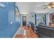 Cozy living room with wood-look floors, stylish furniture, and beach themed decor accents at 566 Reading Nw St, Port Charlotte, FL 33952