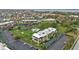Scenic view of condo community with a pool and lush landscaping, plus convenient parking at 601 Shreve St # 64C, Punta Gorda, FL 33950