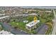 Aerial view showcasing the condominium complex's landscaping, pool, and proximity to the intercoastal waterway at 601 Shreve St # 64C, Punta Gorda, FL 33950