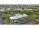 Scenic aerial shot showcasing the community, pool area, manicured landscaping, and covered parking at 601 Shreve St # 64C, Punta Gorda, FL 33950