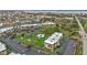 Drone shot featuring the community, including a pool area, landscaping, and parking at 601 Shreve St # 64C, Punta Gorda, FL 33950