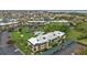 Overhead view of well-maintained grounds, community pool, and convenient covered parking at 601 Shreve St # 64C, Punta Gorda, FL 33950