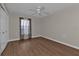 Bedroom featuring wood flooring, large windows, and a ceiling fan at 601 Shreve St # 64C, Punta Gorda, FL 33950